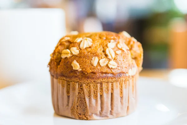 Muffin on wooden table — Stock Photo, Image