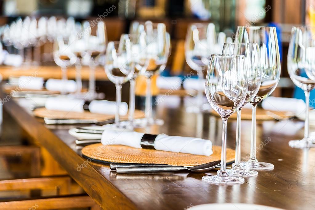 Wine glass on dining table in restaurant