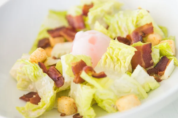 Caesar salad on white dish — Stock Photo, Image