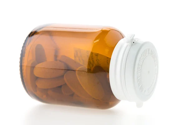 Pills in glass bottle — Stock Photo, Image