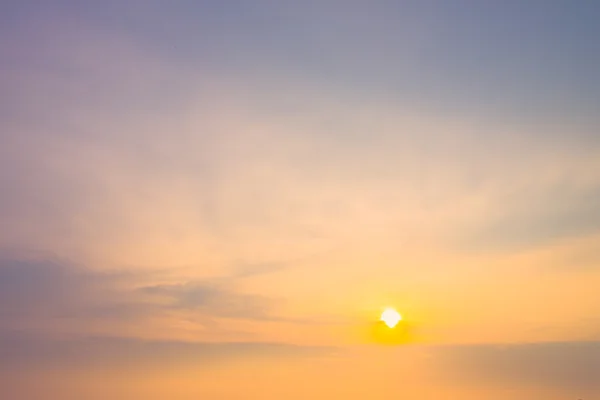 Sun and clouds at twilight time — Stock Photo, Image