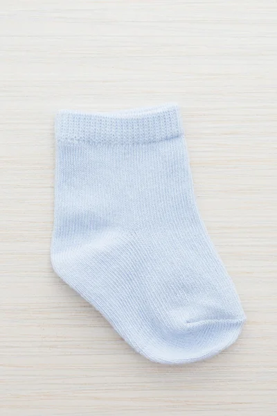 Sock on wood background — Stock Photo, Image