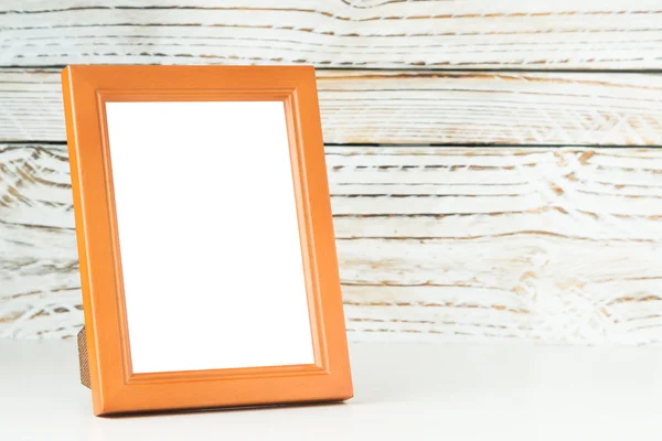 Frame on wood table — Stock Photo, Image