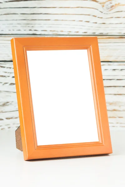 Frame on wood table — Stock Photo, Image