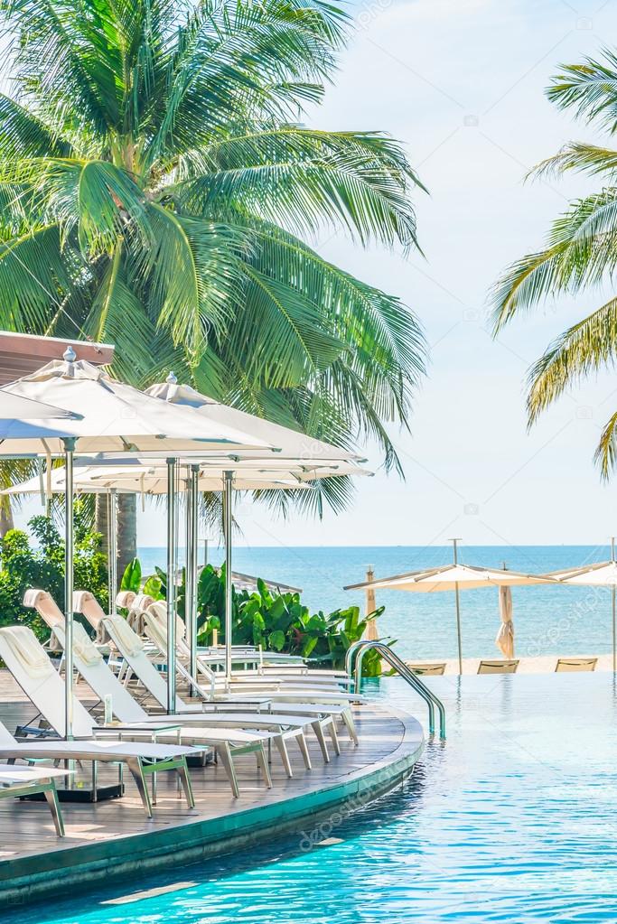 Umbrellas and chairs in hotel pool resort