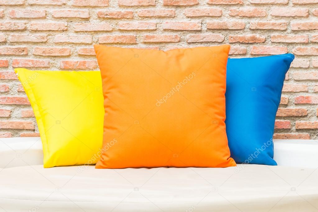 Colorful pillows on bed