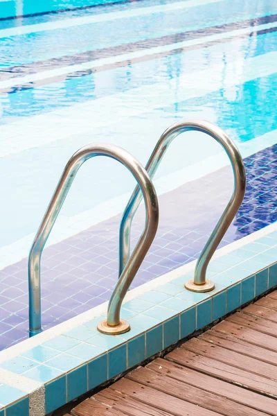 Metal stairs in pool — Stock Photo, Image