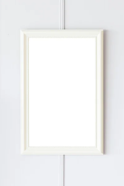 Marco en blanco en la pared blanca — Foto de Stock