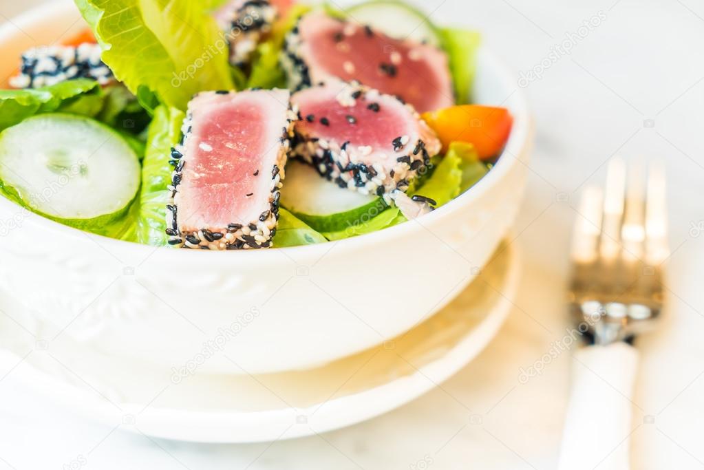 Grilled tuna salad in white bowl