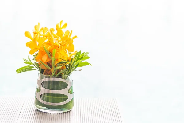 Vase with yellow flowers — Stock Photo, Image