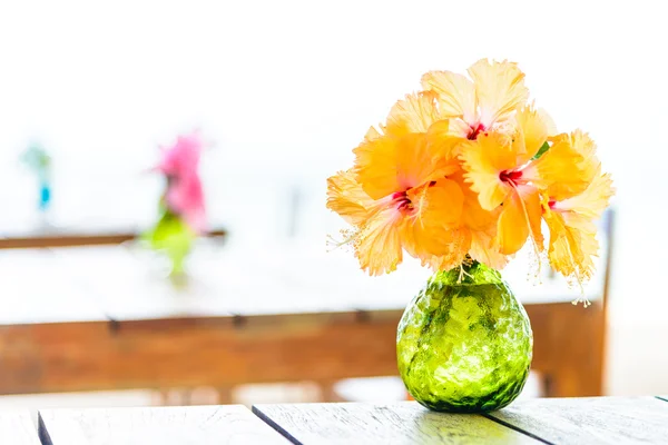 Flowers in vase on wooden table — Stock Photo, Image