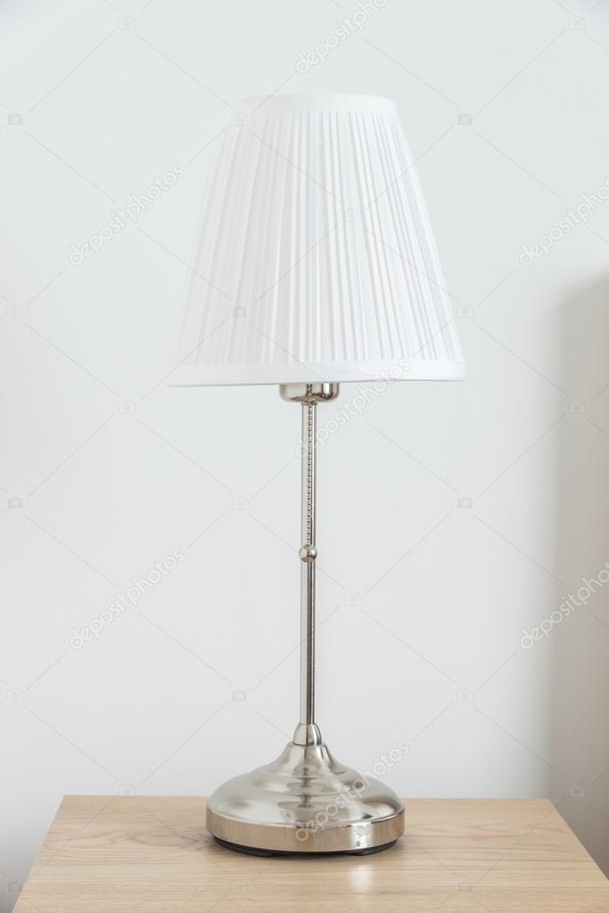 lamp beside bed