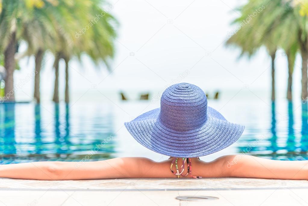 Woman in hotel pool resort