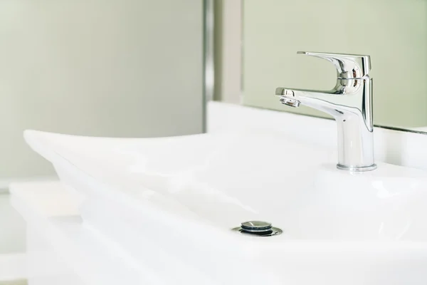 Faucet water in bathroom Royalty Free Stock Images