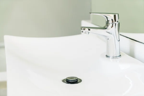 Faucet water in bathroom Stock Photo