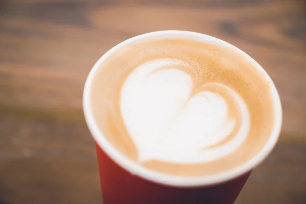Heart latte coffee in red cup — Stock Photo, Image