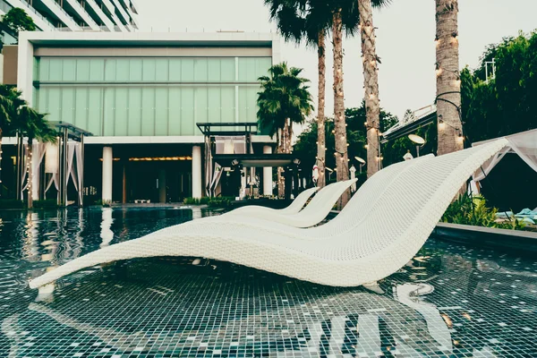 Luxury pool Chairs in hotel swimming pool — Stock Photo, Image