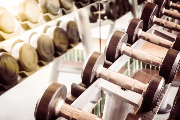 Dumbbell equipment in fitness gym room — Stock Photo, Image