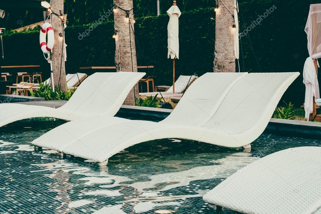 Beautiful luxury pool Chairs Stock Photo by mrsiraphol 98369624