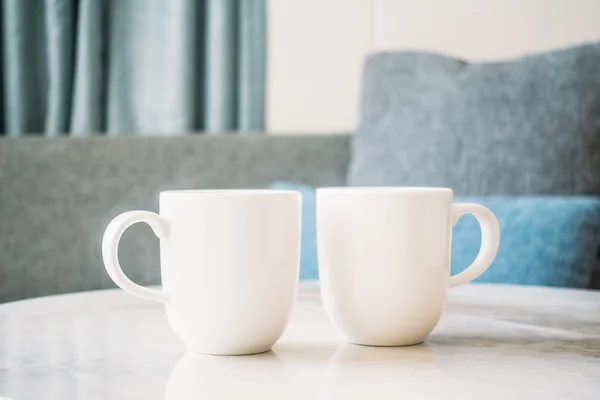 White coffee cups on stone table — Stock Photo, Image