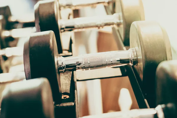 Dumbbells in fitness and gym room — Stock Photo, Image