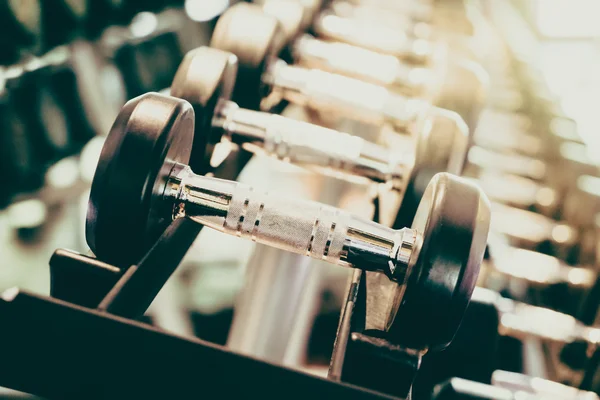 Dumbbells in fitness and gym room — Stock Photo, Image