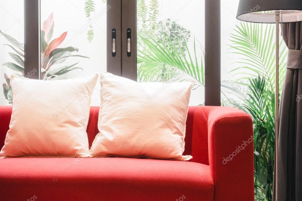red sofa with pillows