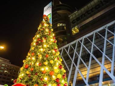 Bangkok/Thailand - 13 December 2018: Christmas Tree in front of Central world deparment store with Tourist walking in Christmas eve day.bangkok City thailand