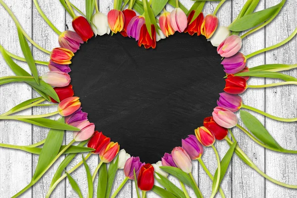 Heart shaped out of tulips — Stock Photo, Image