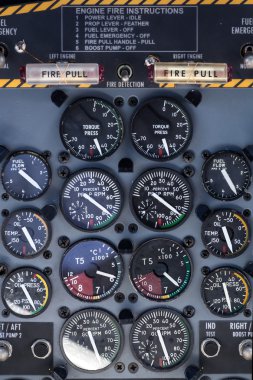 airplane dashboard with circular instruments clipart