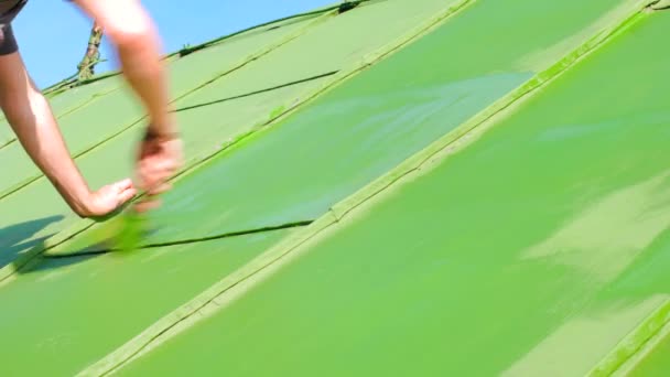 Man Painting Roof With Proceting Layer — Stock Video