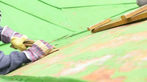 Woman Sitting Next to the Ladder, Scraping Paint — Stock Video