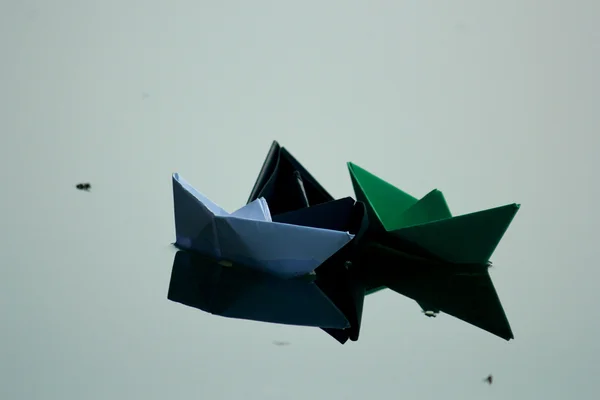 Paper boat floating on water — Stock Photo, Image