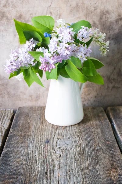 Lilac in vase on background,close up