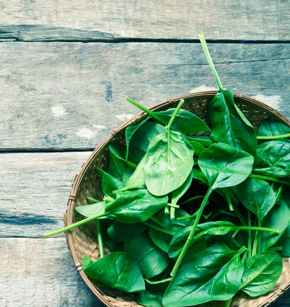 Spinach close up on a wooden background — Stock Photo, Image