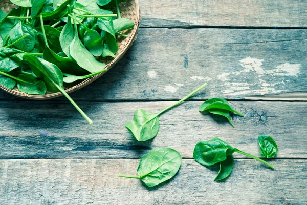 Spinach close up on a wooden background — Stock Photo, Image