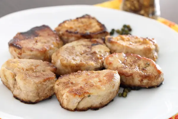 Roasted pork fillet in white plate — Stock Photo, Image