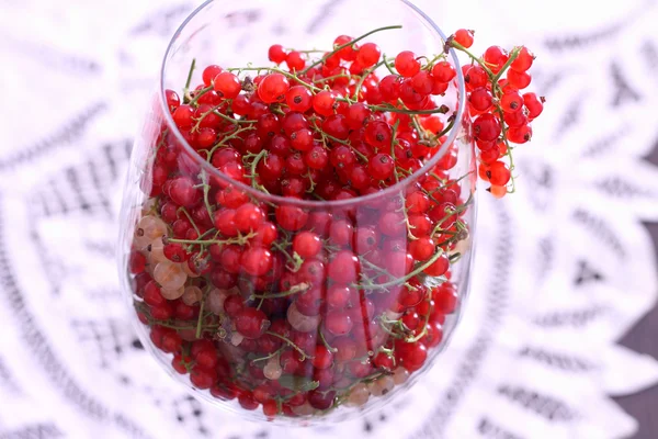 Yellow and red currant in balloon wine glass — Stok fotoğraf