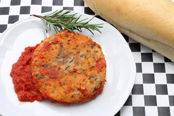 Trout fishburger with tomato sauce — Stock Photo, Image