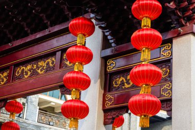 Red lanterns hung upstairs in the Chinese-style archway