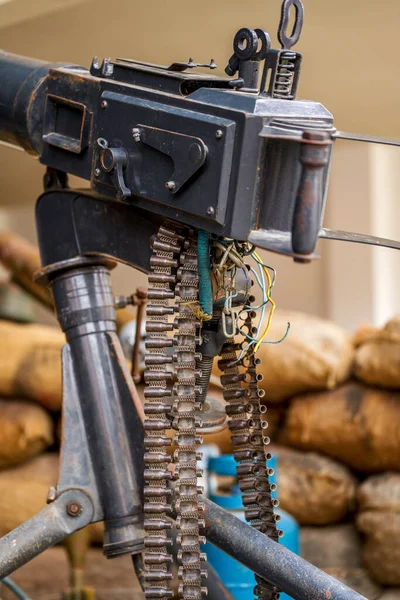 Close-up of heavy machine gun model in military summer camp
