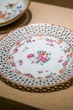 Close-up of tea cups with painted tableware in Lingnan style, Guangdong, China