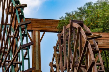 Chinese village traditional wooden waterwheel close-up, farming equipment
