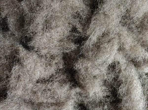 Close-up gray synthetic wool. Filler for production. — Stock Photo, Image