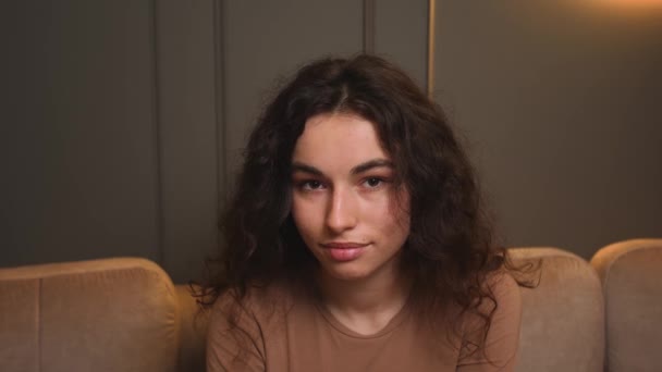 Confident smiling young woman looking at camera standing at home office. Happy pretty woman face posing for close up portrait indoors. — Stock Video