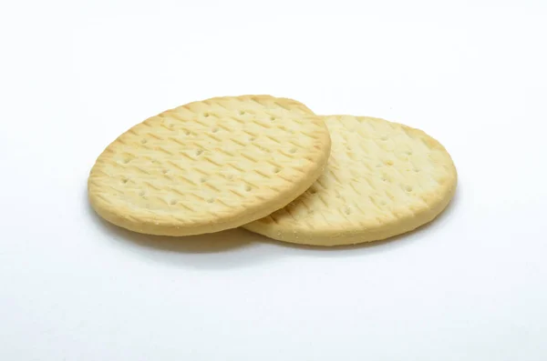 Appetizing ruddy wheat cookies on a light background — Stock Photo, Image