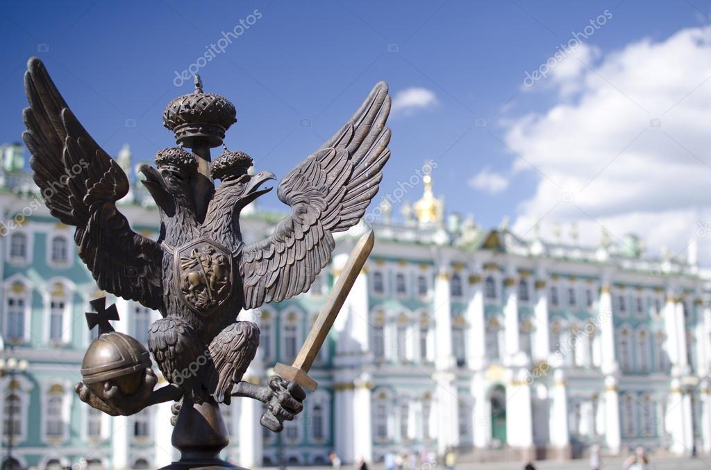Monarchy symbol against the Winter Palace