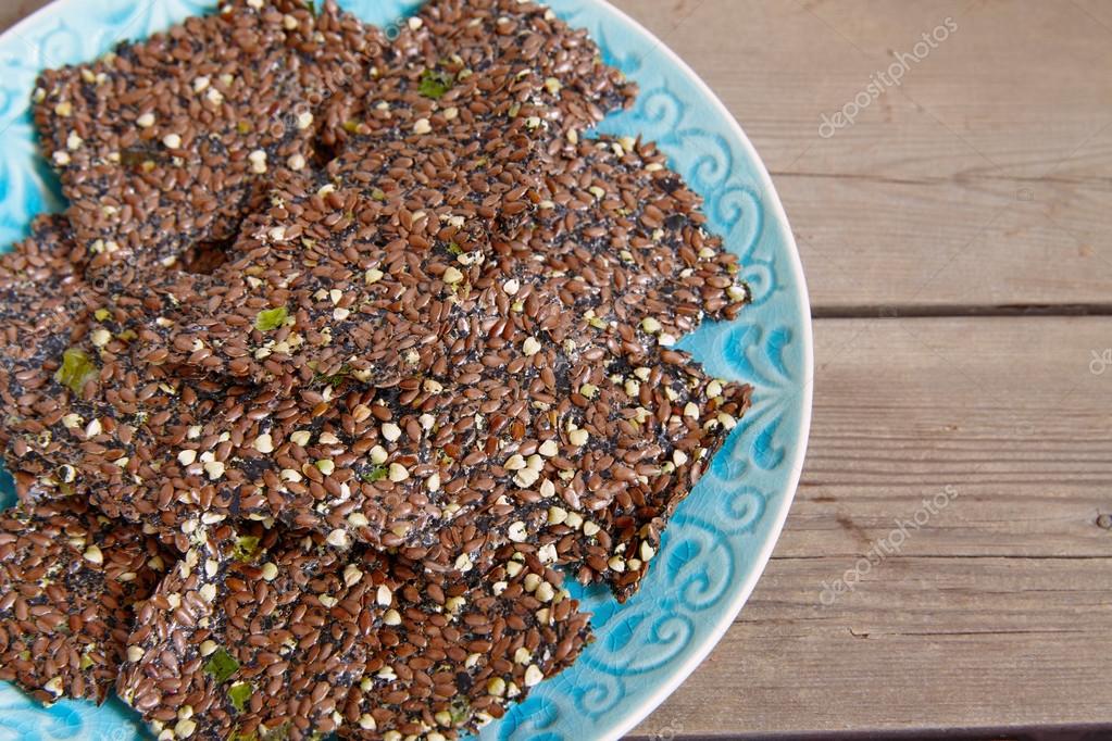 Flaxseed crackers with seaweed Stock Photo by ©Odelinde 106102586
