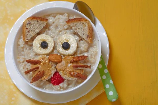 Funny oatmeal with cat face decoration — Stock Photo, Image