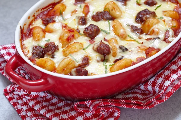 Homemade gnocchi with sausage and sauce — Stock Photo, Image